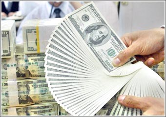 «الوطني»: تداولات هادئة نسبياً على الدولار مقابل سلة عملات