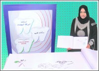 مواطنة تدخل «غينيس» بأكبر كتاب تلوين عربي عن الأسنان «البراقة البيضاء»