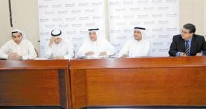الغانم ومناف الهاجري في جانب من عمومية الشركةكرم دياب
