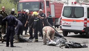 جثث واشلاء ضحايا الانفجار المزدوج الذي ضرب المصرف الحكومي في بغداد امس 	افپ
﻿