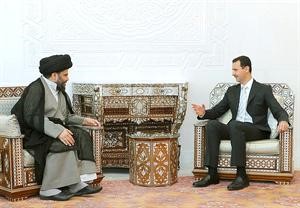 الرئيس السوري دبشار الاسد مرحبا بالزعيم الشيعي العراقي مقتدى الصدر في دمشق امس	 افپ
﻿