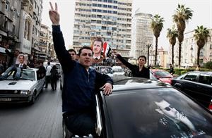 مسيرات مؤيدة للرئيسالسوري بشار الاسد في دمشق امس افپ