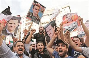 لبنانيون وسوريون تظاهروا في ضاحية بيروت الجنوبية تاييدا للاسد افپ﻿