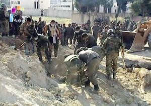 صورة عن التلفزيون السوري لما قال انها مقبرة جماعية في جسر الشغور	 افپ﻿