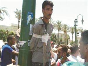 البلطجي معلقا على العامود