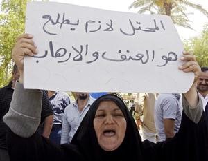 عراقية تطالب بخروج الجيش الاميركي خلال تظاهرة في بغداد امس	افپ﻿