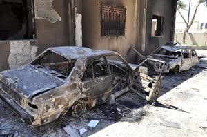 صورة وزعتها سانا لسيارات شرطة قالت ان ارهابيين قاموا باحراقها خلال عملياتهم التخريبية في حماة	اپ﻿