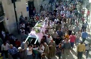 صورة عن الانترنت لجنازة احد المتظاهرين في قرية مورك التابعة لحماة افپ