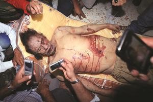 ﻿القذافي قتيلا وليبيا حرة﻿