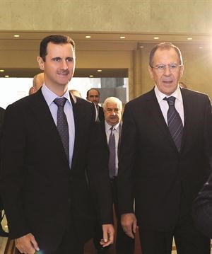 الرئيس السوري بشار الاسد مستقبلا وزير الخارجية الروسي سيرغي لافروف افپ