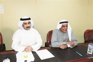عبدالمحسن المشعان وبدر الشمري خلال عمومية غلف انفست المؤجلة اسامة ابوعطية﻿