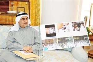 احمد لاري وبجانبه صور اقتحام المجلس
