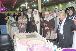 وزير الشؤون الاجتماعية الفريق احمد الرجيب في جناح الكويت اسامة ابوعطية ﻿