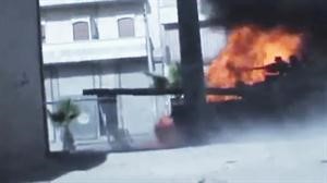 صورة بثها ناشطون لاستهداف دبابة للجيش النظامي في حلب	 اپ﻿