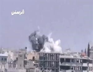 صورة بثها ناشطون لما قالوا انه قصف القوات النظامية لاحد مساجد الرستن