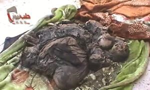 صورة بثها ناشطون لسيدة واولادها الثلاثة احرقوا في حلب امس	﻿