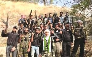 صورة عن فيديو للملازم اول اميرة عرعور تعلن فيه انشقاقها عن الجيش السوري وتشكيل اول كتيبة تابعة للجيش الحر تقودها امراة باسم كتيبة الاقصى المبارك افپ