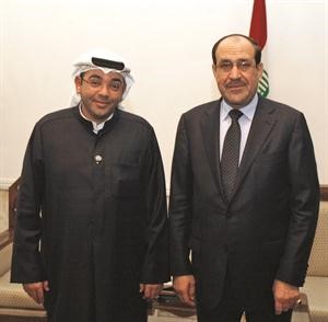 نوري المالكي مع رئيس التحرير الزميل يوسف خالد المرزوق﻿