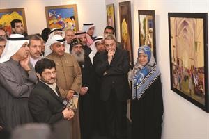 عبدالحميد دشتي والسفير الايراني روح الله قهرماني والسفير العراقي والحضور خلال جولة في المعرض	 هاني عبدالله﻿