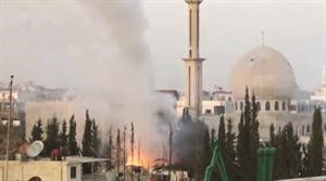 صورة عن فيديو بثه ناشطون للحظة سقوط قذيفة من طائرة ميغ على داريا امس