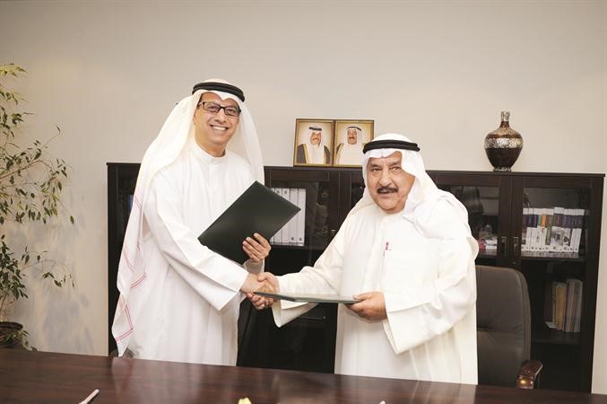 دبدر مال الله وعقيل الجاسم خلال تبادل مذكرة التفاهم 	فريال حماد﻿