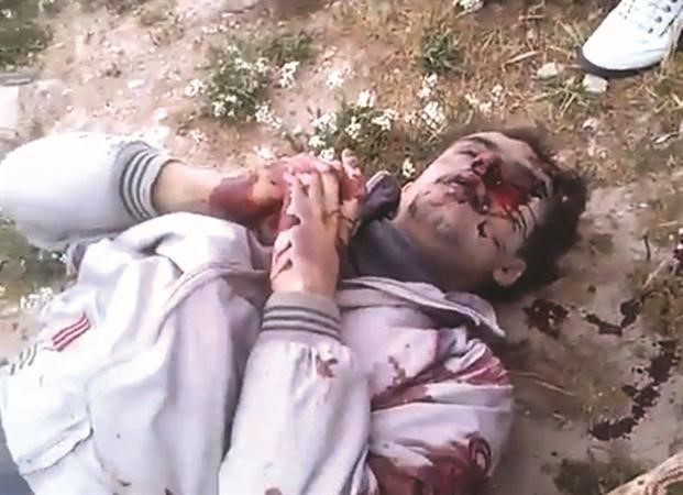 صورة احد ضحايا مجزرة جديدة الفضل ماخوذة من فيديو وزعته صفحة الثورة السورية على الانترنت
