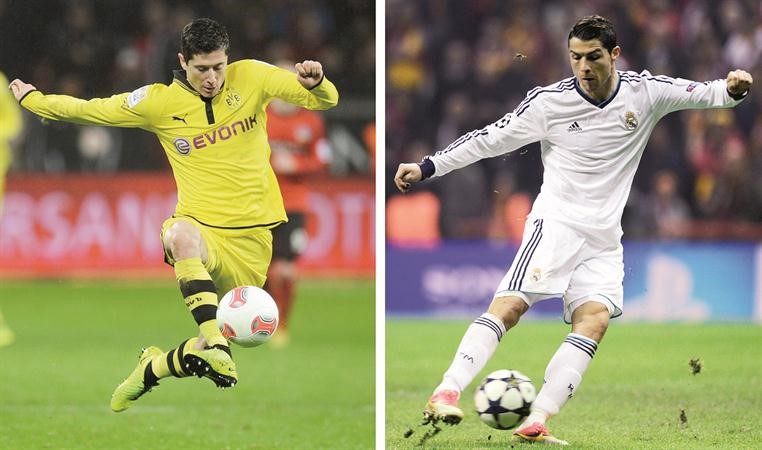نجم هجوم ريال مدريد رونالدو في مواجهة مع مهاجم دورتموند ليفاندوفسكي افپ