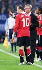 فيرغسون موجها روني خلال احدى مبارايات يونايتد