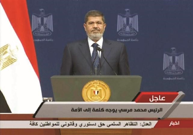 الرئيس المصري محمد مرسي قبيل بدء خطابه امس	 افپ ﻿