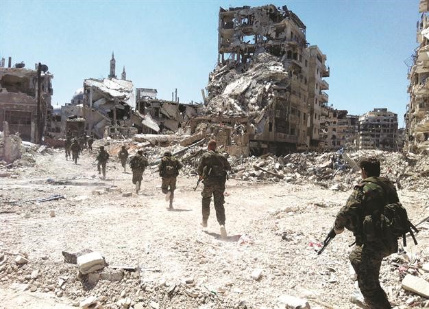 قوات النظام السوري تدخل حي الخالدية المدمر بعد اكثر من شهر من القصف افپ
