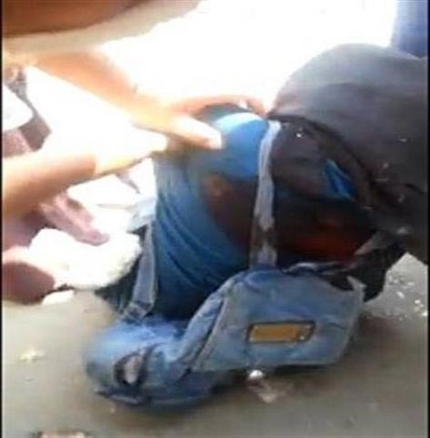بالفيديو.. قنص منتقبة أمام الكاميرا في محيط رابعة العدوية