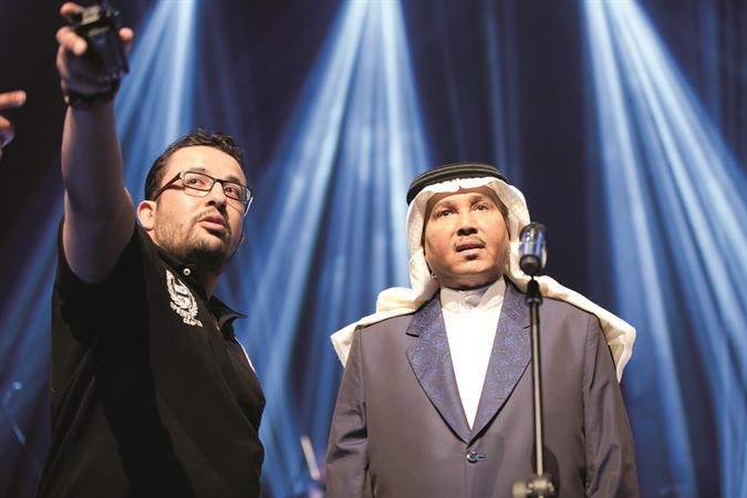 يعقوب المهنا مع فنان العرب محمد عبده اثناء تصوير الكليب﻿
