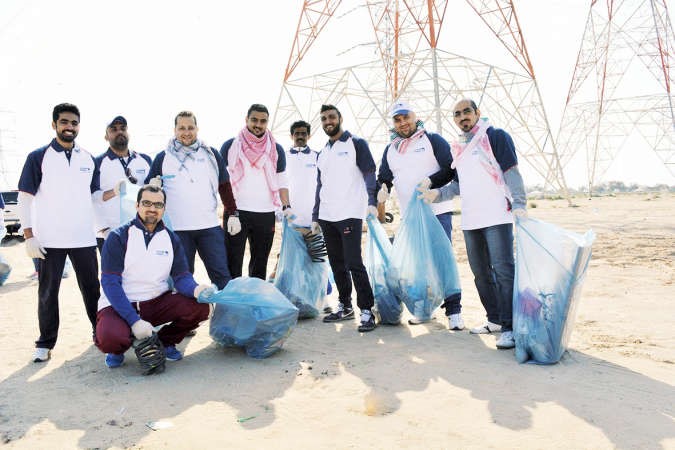  متطوعو الوطني خلال حملة التنظيف
