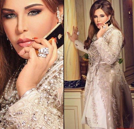 بالصور.. أحلام تستعرض هاتفها الجديد من الذهب الخالص عيار 24 المرصع بالألماس