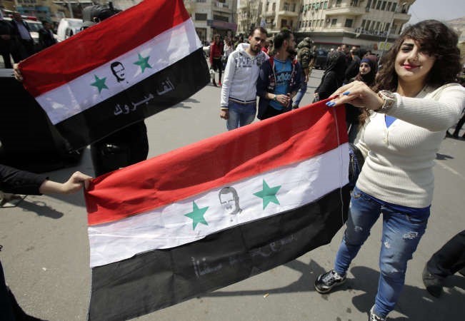 مؤيدو النظام السوري يتظاهرون في دمشق احتفالا بسيطرة الجيش على يبرود 	افپ ﻿