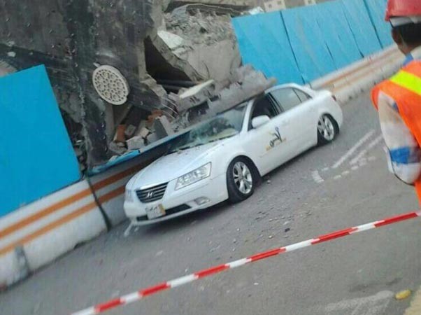 بالصور.. مواطن سعودي يروي قصة نجاته من الموت بعد سقوط مبنى سكني على سيارته 