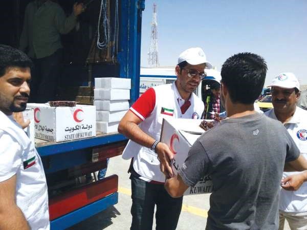 جانب من توزيع المساعدات على اللاجئين السوريين في الاردن