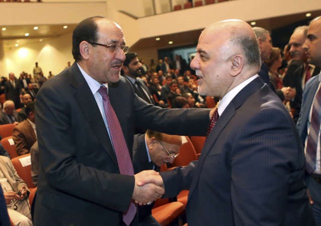 المالكي يهنىء خليفته حيدر العبادي عقب نيله ثقة البرلمانافپ﻿