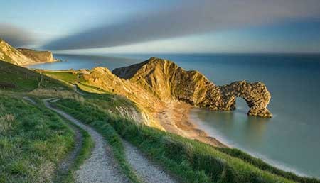 The last of the evening light on Durdle Door، تصوير جيك بايك، في جنوب دوريست