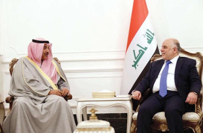 الخالد اثناء لقائه رئيس الوزراء العراقي حيدر العبادي﻿