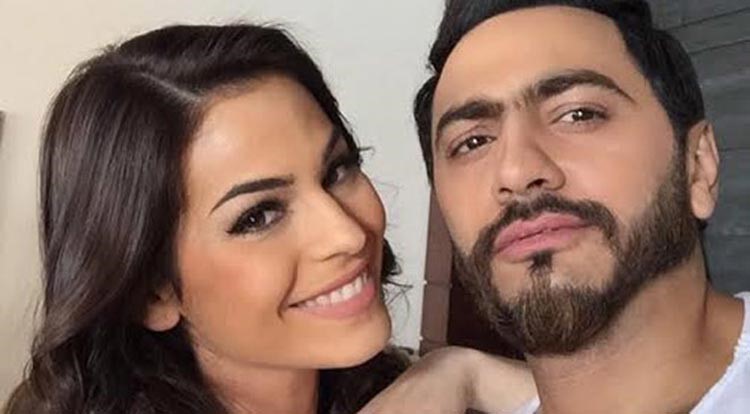 تامر حسني يثير غيرة معجباته بصورة من كليبه الجديد
