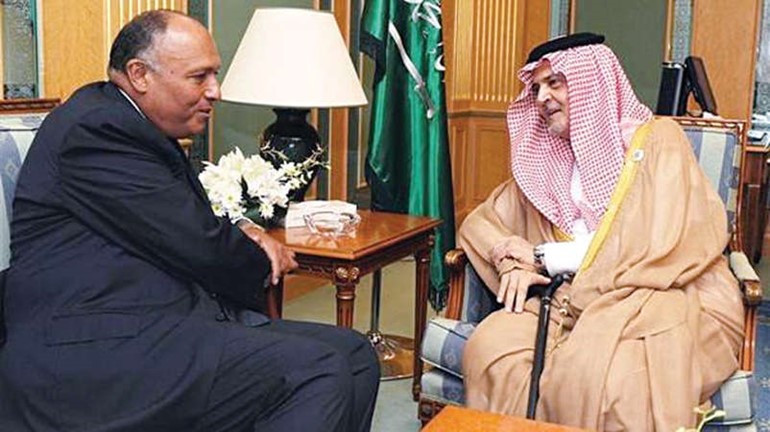 صاحب السمو الملكي الامير سعود الفيصل وزير الخارجية السعودي ملتقيا نظيره المصري سامح شكري في باريس 