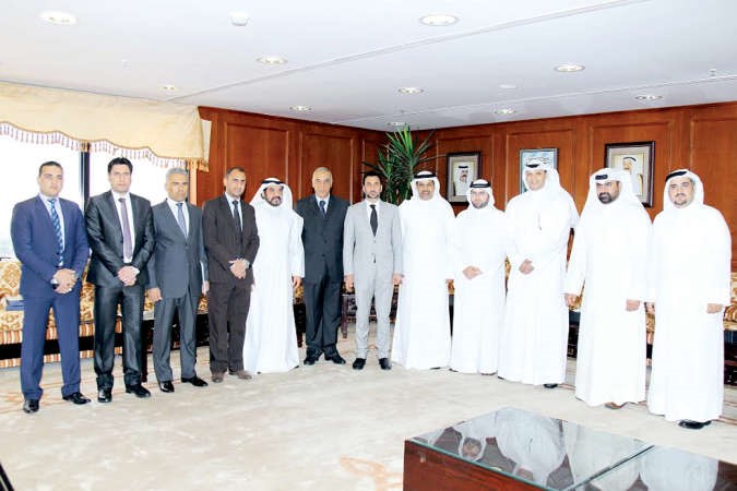 د حمود فليطح ووزير الرياضة والشباب العراقي عبدالحسين العبطان والوفد الزائر في الهيئة ﻿