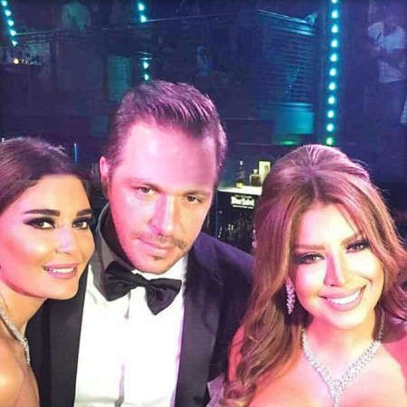 امل وزوجها في حفل الزفاف ومعهما سيرين عبدالنور