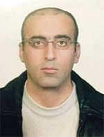 والصورة التي وزعتها الوكالة الوطنية للاعلام للاسير بعد تعديل شكله قبيل سفره