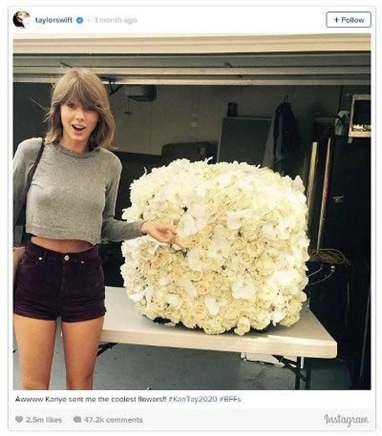 المغنية Taylor Swift مع باقة كبيرة من الورود تلقتها من المغني كانييه ويست