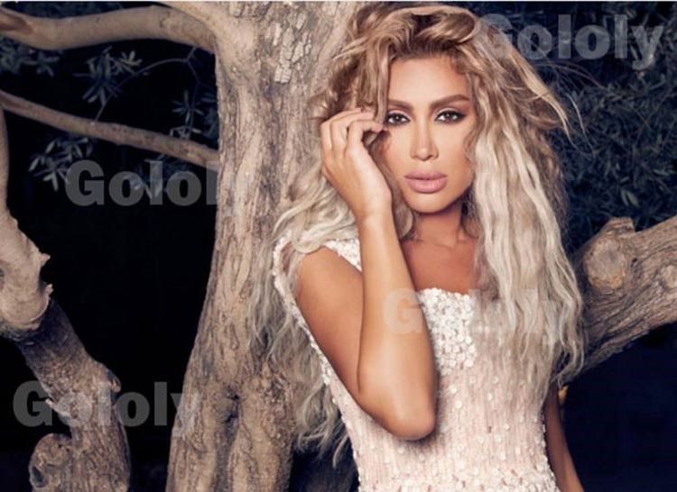 بالصور.. مايا دياب في البحر بفستان زفاف!