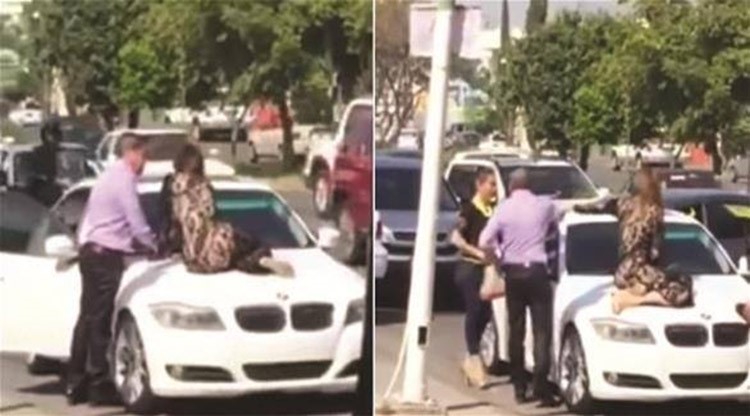  بالفيديو.. جلست على سيارة زوجها لمنعه من الذهاب مع عشيقته
