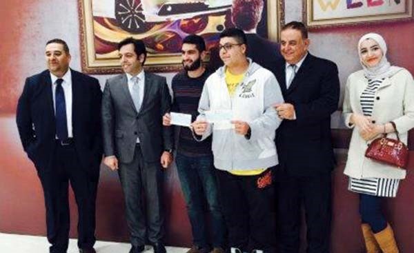 من اليمين علياء جمال وعماد ملاعب وبسام صالح وعلي ديب وخليل عبود ولؤي احمد خلال المسابقة