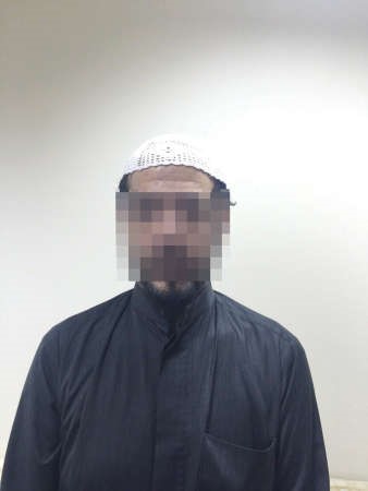 المتهم بعد ضبطه 
